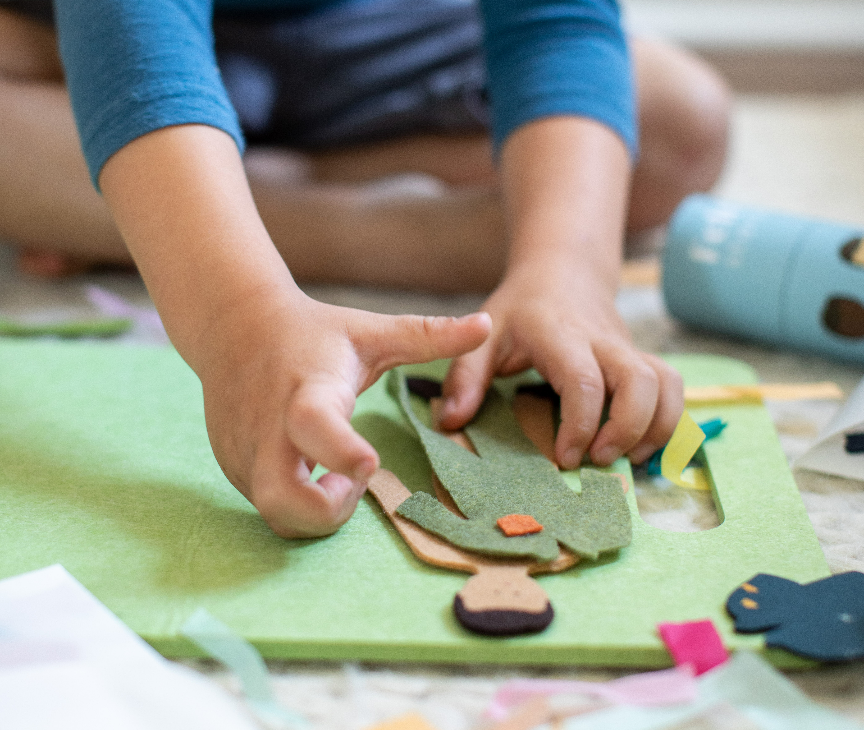 Felt boy doll with changeable clothes